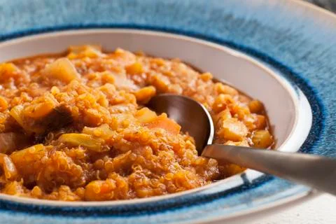 Quinoa stew with spoon Stock Photos