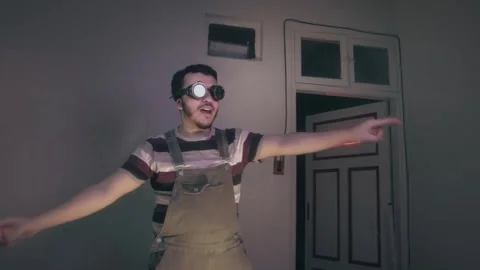 Quirky Guy in Goggles Dancing Live with Neon On Air Sign Stock Footage 340401372