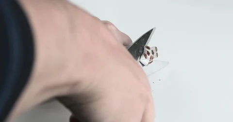 Quit smoking concept, man cuts cigarettes with scissors Stock Footage 141343531