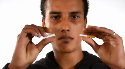 Quit smoking. Young man breaking a cigarette. Video stock 38568032