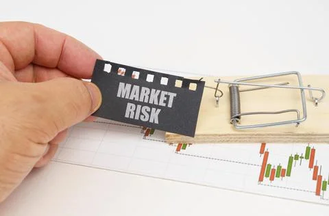 On the quote chart there is a mousetrap from which the hand takes out a sign  Stock Photos