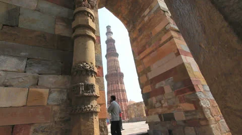 Qutab Minar is seen through an arch c Stock Footage 24664714