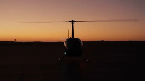 R-44 Robinson Helicopter Taking Off with Evening Sky Stock Footage 123672580