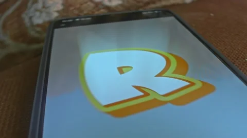 R programming language themed graphic presentation on smartphone Stock Footage 303425266