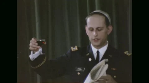 Rabbi raising a toast and drinking wine while praying Stock Footage