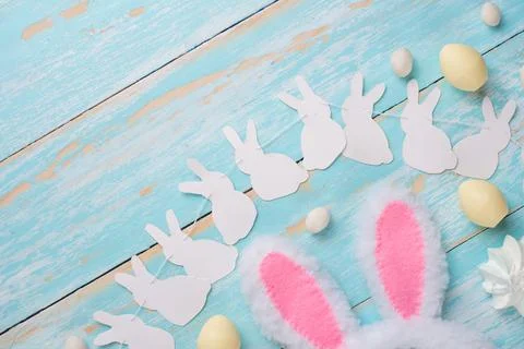 Rabbit ears and sweets. Easter background. Top view, Flat lay Stock Photos