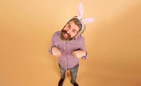 Rabbit man. Easter day celebration. Funny bearded man in bunny ears. Easter.. Stock Photos