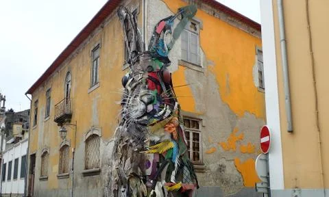 Rabbit or bunny on side of worn building Stock Photos
