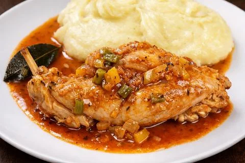 Rabbit in Provençal sauce served with mashed potatoes, a traditional French dish Stock Photos