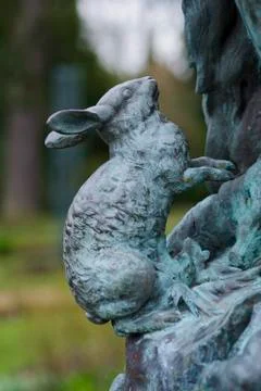 Rabbit Statue on Pan Statue in the Rose Garden of Sheffield Botanical Gardens Stock Photos