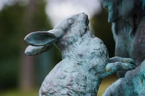 Rabbit Statue on Pan Statue in the Rose Garden of Sheffield Botanical Gardens Stock Photos