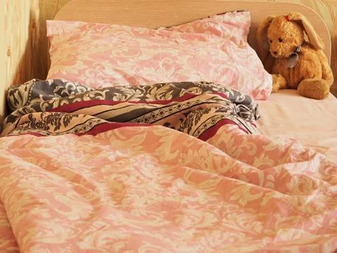 Rabbit toy on the bed Stock Photos