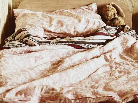 Rabbit toy on the bed Stock Photos
