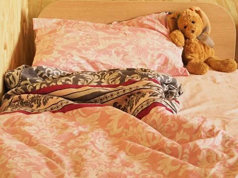 Rabbit toy on the bed Stock Photos