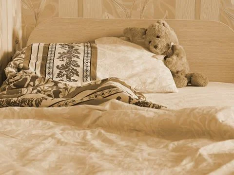 Rabbit toy on the bed Stock Photos