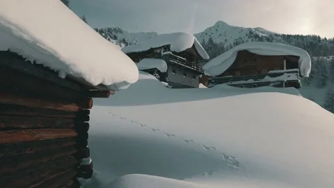 Rabbit tracks at snowy mountain huts in the South Tyrolean mountains. Stock Footage 145083146