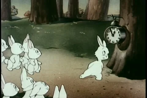 Rabbits in forest waiting for clock to strike one Vídeos de archivo 11345104