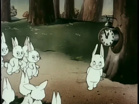 Rabbits in forest waiting for clock to strike one Stock-Footage 260246890