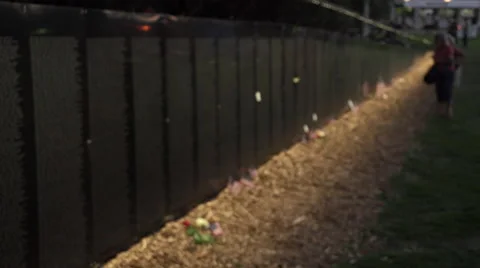 Rac focus of visitors looking at names on Vietnam Wall That Heals. Stock Footage 47392285