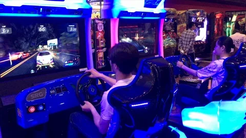 Race arcade game in AEON Mall Binh Tan in Ho Chi Minh City, Vietnam Stock Footage 107613612