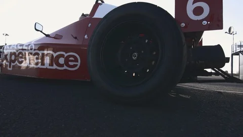 Race car accelerates and burn tires and it leaves the frame Video stock 127407300
