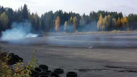 Race Car Drifting on Road through Forest · Free Stock Photo