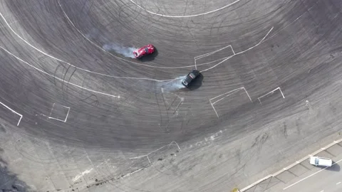 Aerial top view car drifting on asphalt race track with start and