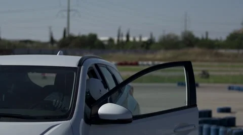 Race car driver gets out of the car  (2) Stock Footage 41265835