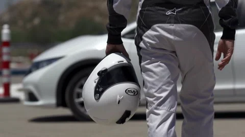 Race car driver walking to the car 2 Stock Footage 41266947