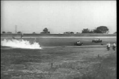 Race car driving through wall of fire to finish line Stock Footage 11352555