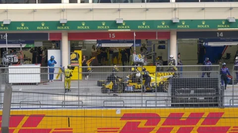 A race car enters the pit for a driver change during the 8 Hours of Stock Footage 200191819