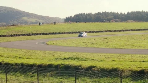 Race Car losing control and crashing into barrier Slow Motion Stock Footage 73559452