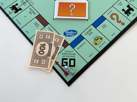 The race car  on the Passing Go square for the game Monopoly by Hasbro on a w Stock Photos