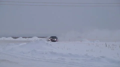 Race car in a snow drift Stock Footage 62021777