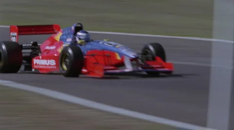 A race car speeds between two turns. Stock Footage 4945119