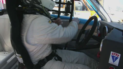 Race driver belts up 2 Stock Footage 49643102