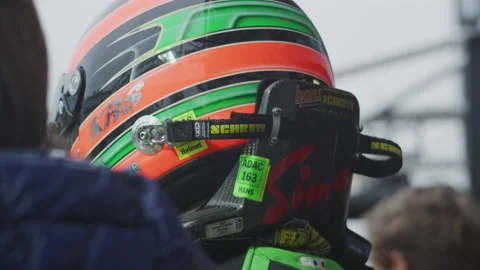 Race driver with helmet in Pit Stop at Car Racing - Auto Race - Slow Motion Stock Footage 146192664