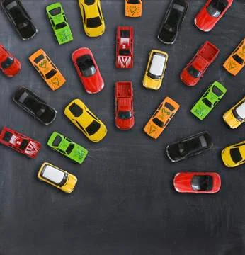 Race or competition concept with multiple toy cars on a blackboard Stock-Fotos