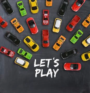 Race or competition concept with multiple toy cars on a blackboard Stock Photos