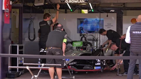 Race Team Mechanics Working in Monaco Grand Prix Garage 4K Video stock 336665541