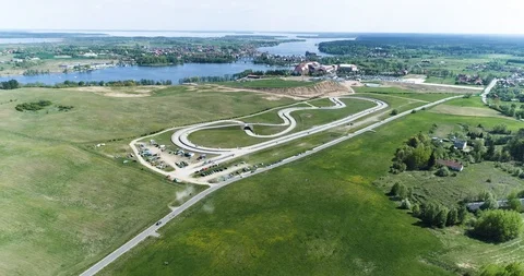 Race track among fields and lake Stock Footage 89416184