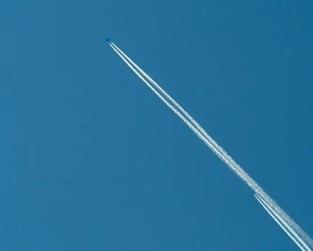 Race of two planes at the clear blue sky Stock Photos