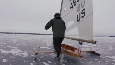 A racer starts a practice run on a DN iceboat Stock Footage 158904634