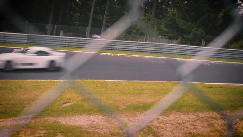 Racetrack surrounded by forest. Looking through fence Stock Footage 111425787