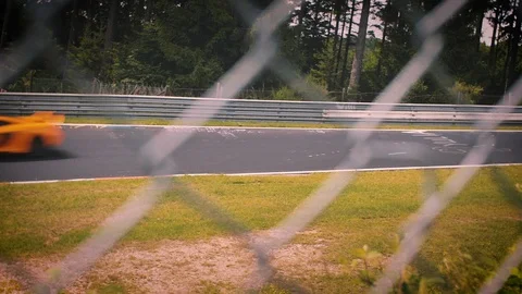 Racetrack surrounded by forest. Looking through fence Stock Footage 111425789