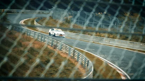 Racetrack surrounded by forest. Looking through fence Stock Footage 111426890