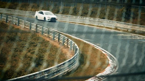 Racetrack surrounded by forest. Looking through fence Video stock 111557738