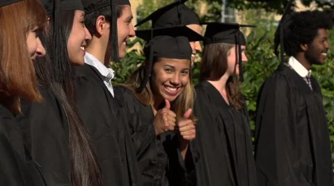 A racially-diverse group of students at graduation - slow motion Stock Footage