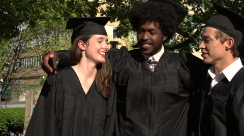 Racially-diverse students take a selfie at graduation - slow motion Stock Footage 44111944