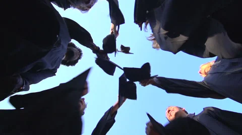 Racially diverse students throw mortarboards in the air - slow motion Stock-Footage 44112220